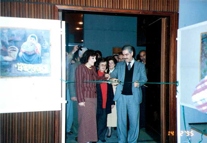 Artist Janette Sarraf Farah and Yahya Yakhlef the Palestinian minister of culture at the time at Sarraf-Farah's exhibition opening in Rashad Shawa Cultural Center in Gaza, 1995. Courtesy of the Farah family.jpg